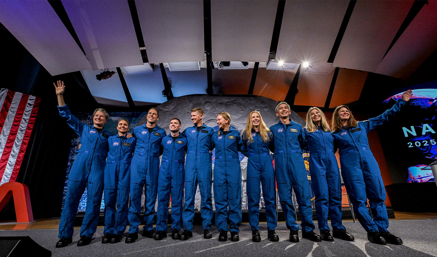 Group of NASA astronaut candidates in jumpsuits