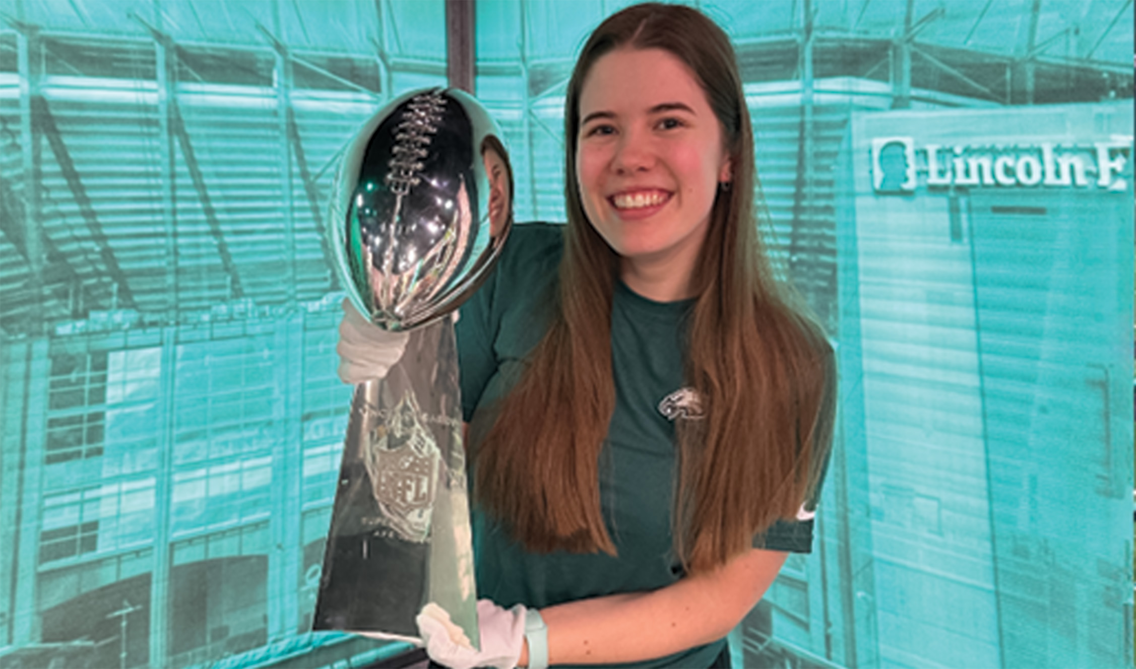 Woman holding up trophy